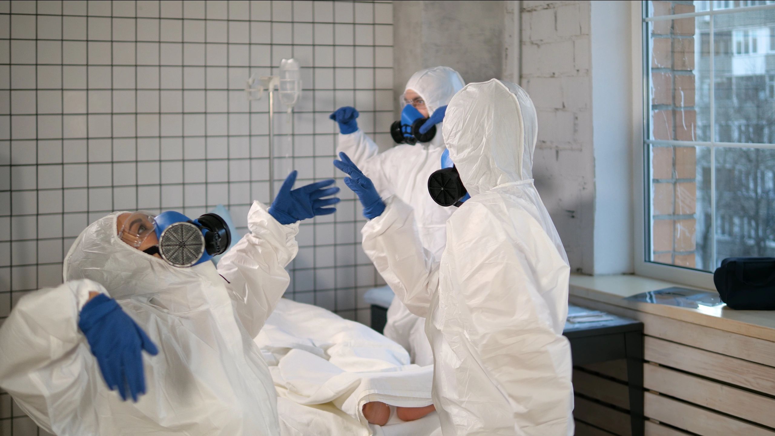 Protective-suited workers representing specialized abatement support