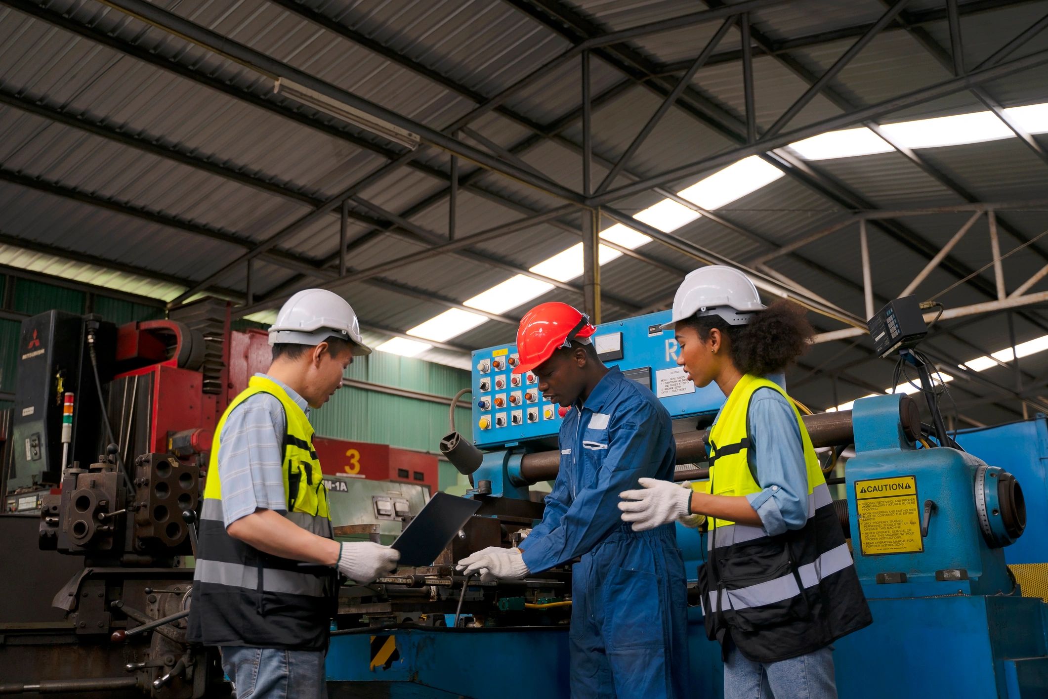 Construction workers in an industrial setting