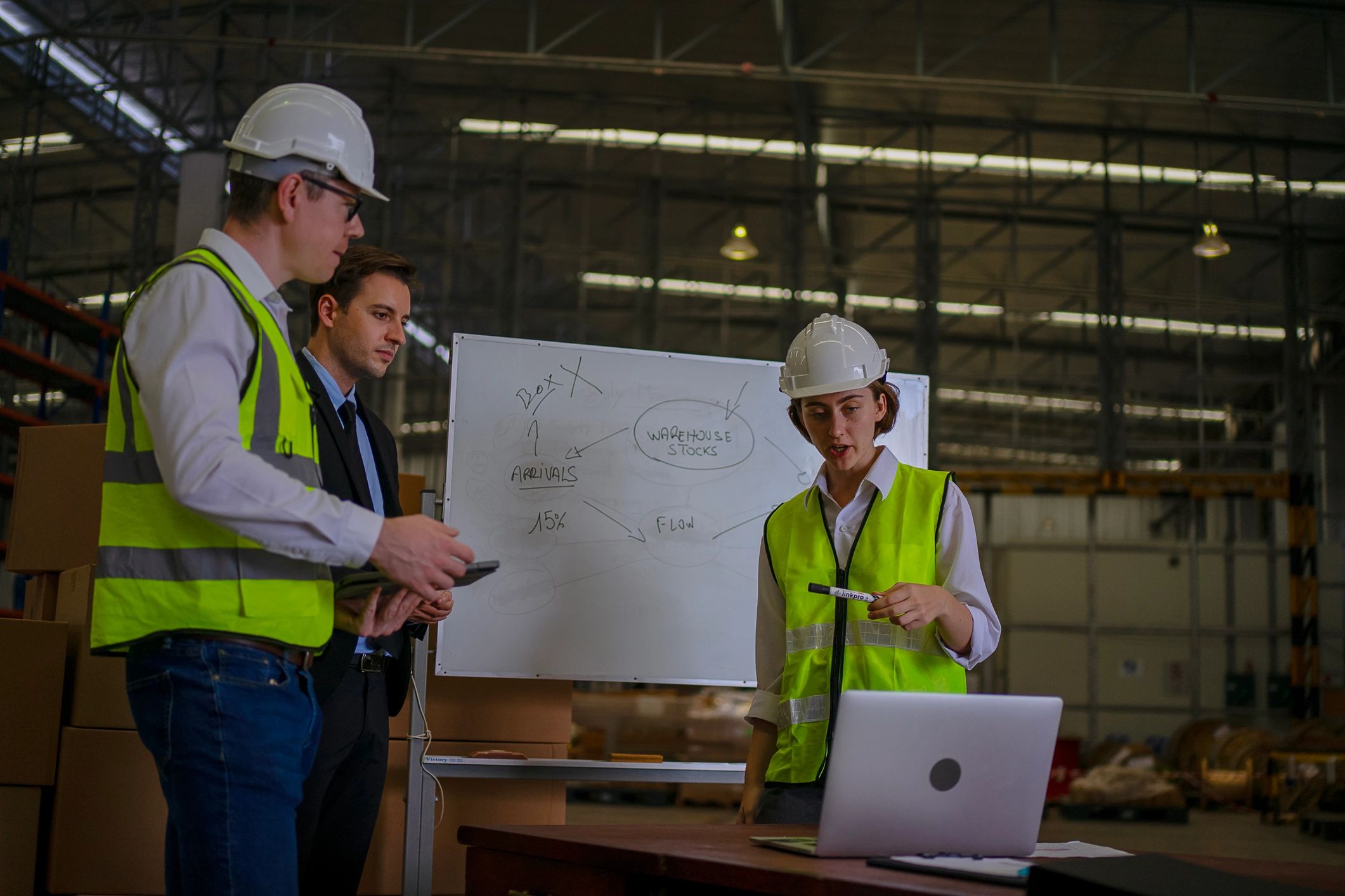 Blue collar workers meeting in an industrial environment