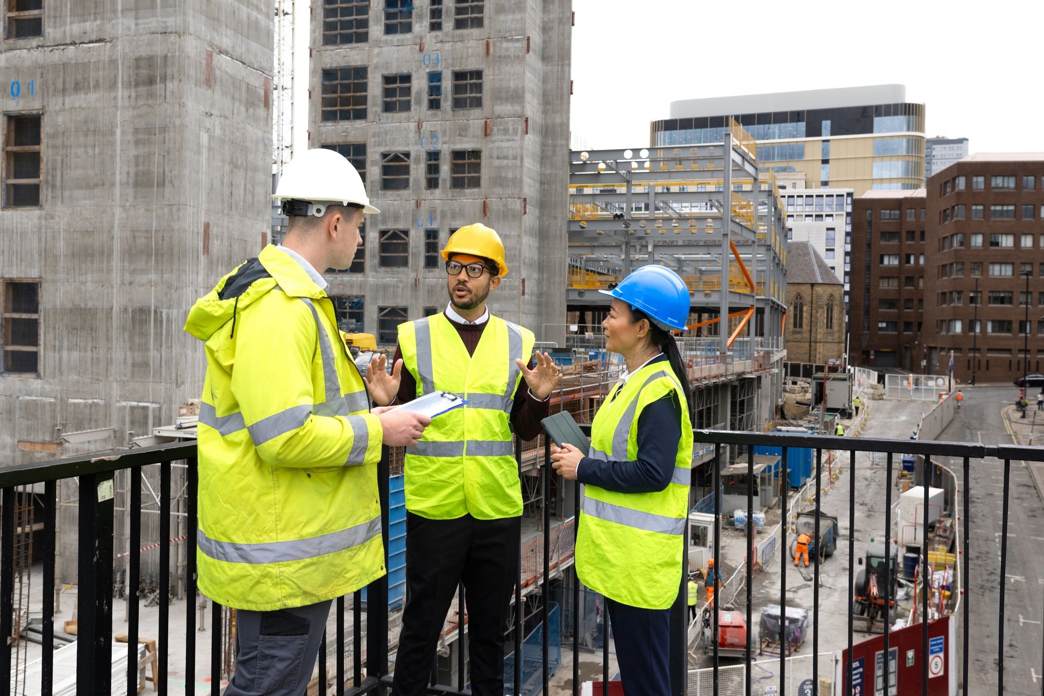Construction team reviewing plans on a job site